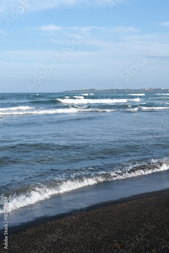waves on the beach in jeju