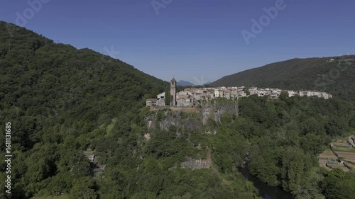 Wallpaper Mural Medieval village of Castellfollit de la Roca perched atop dramatic basalt cliffs above the Fluvià river in Garrotxa, Catalonia; concept: geology, heritage. Torontodigital.ca