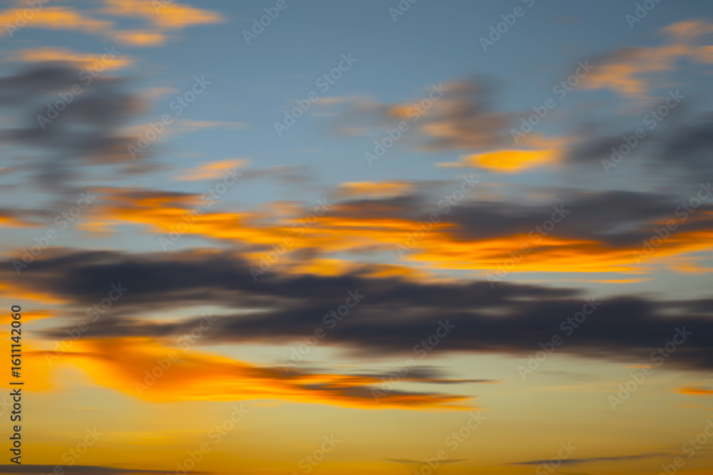 Fototapeta premium A beautiful blurred sunset background with soft, warm hues blending together. Perfect for natural background.