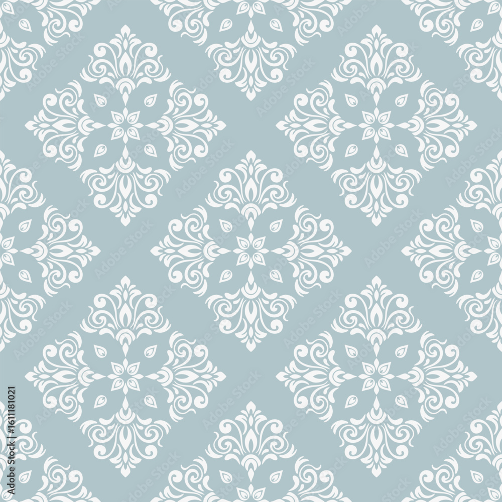 Fototapeta premium Seamless damask floral pattern on blue background.