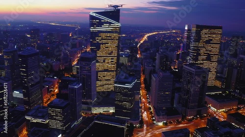 Stunning drone sunset over a vibrant cityscape illuminating life and lights