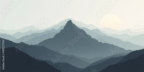 Sunrise over misty mountain peaks