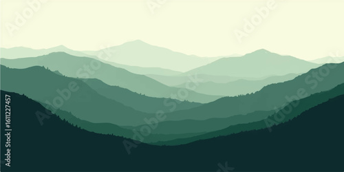 Mountain landscape with clouds and misty peaks