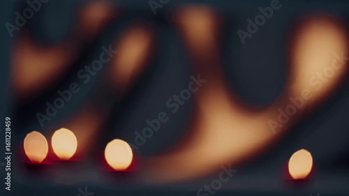 Softly glowing candles illuminate warm shadows in a tranquil evening ambiance