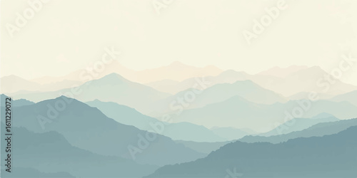 Faded beige mountains blending into a dreamy fog under soft sunrise light