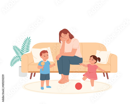 Stressed young mother feeling tired from parental burnout, sitting on a couch with her two active children.