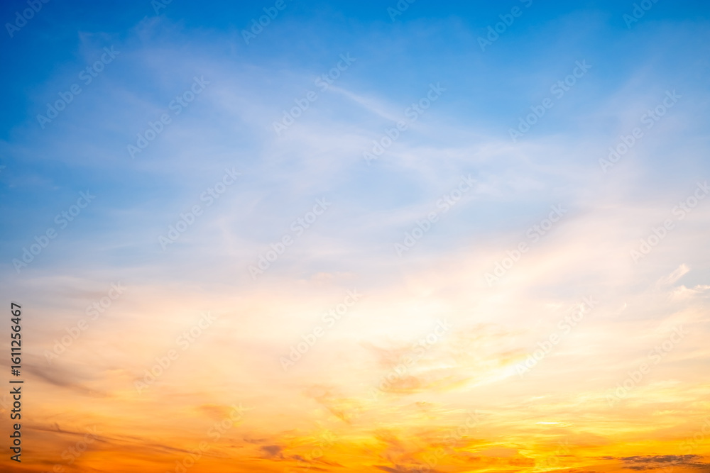 Fototapeta premium Beautiful , luxury soft gradient orange gold clouds and sunlight on the blue sky perfect for the background, take in evening,Twilight, Large size, high definition landscape photo
