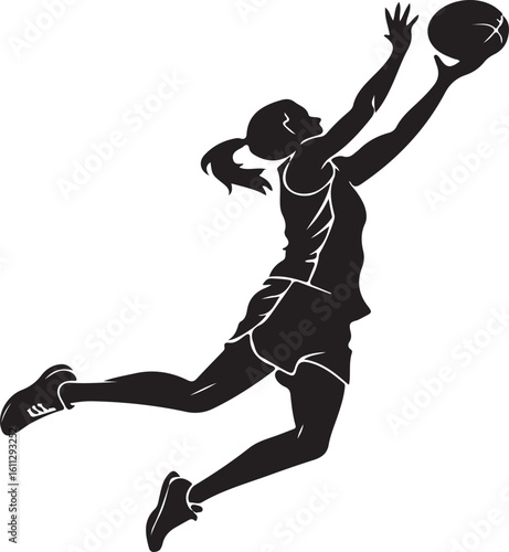 Silhouette of a female netball player in action reaching for the ball during a game