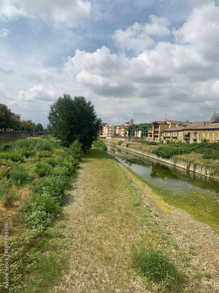 Fototapeta premium View of the Oltratorrente district in Parma, Northern Italy, on a cloudy summer’s day