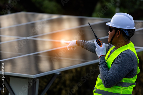 Canvas Print Energy Technician with Radio at Installation Site