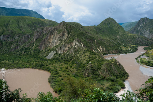 Wallpaper Mural Vibrant Green mountains and river in Peru Torontodigital.ca