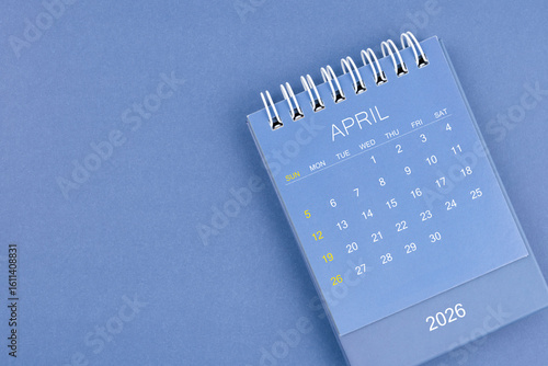Wallpaper Mural April 2026 calendar on blue color background. Desk calendar for planning and organizing. Torontodigital.ca