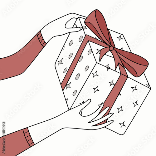 Festive present wrapped in paper with red ribbon
