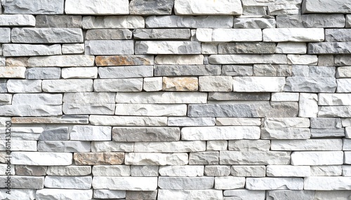 A textured wall of various shades of gray and white stones