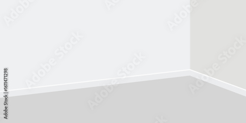 A simple view of a white room with a gray floor and white walls meeting at corner