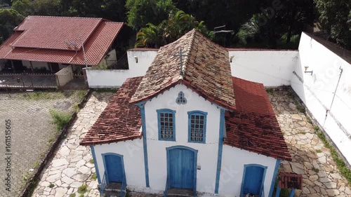 CAPELA DE NOSSA SENHORA DO ROSÁRIO, BETIM,  MINAS GERAIS, BRAZIL - DECEMBER 16, 2021: Drone footage of Igrejinha do Rosário, a historic 19th-century chapel, known for the annual Reinado festivities.