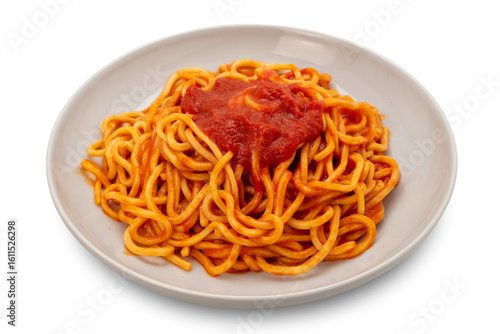 Tagliolini spaghetti pasta with tomato sauce in white plate isolated