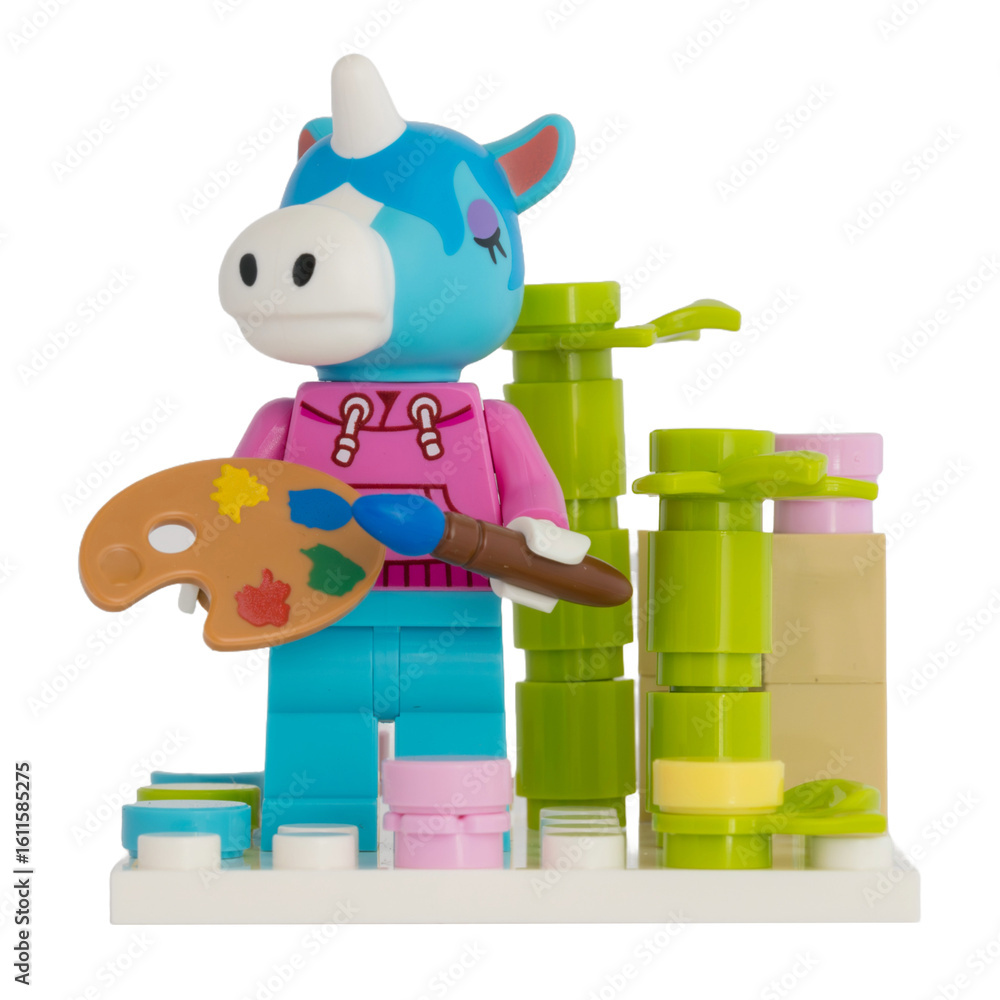 Obraz premium Dortmund - Deutschland 26. Juli 2025 - Lego Figur Einhorn mit Malpalette und Pinsel - Studio Aufnahme