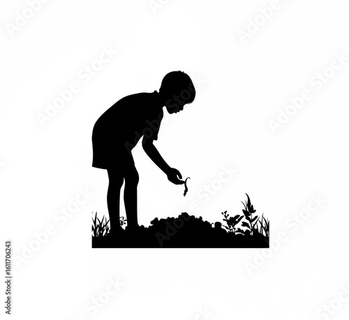 Silhouette of a boy showing a worm found in compost soil