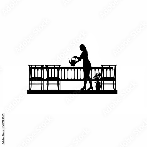 Silhouette of a woman arranging balcony garden furniture