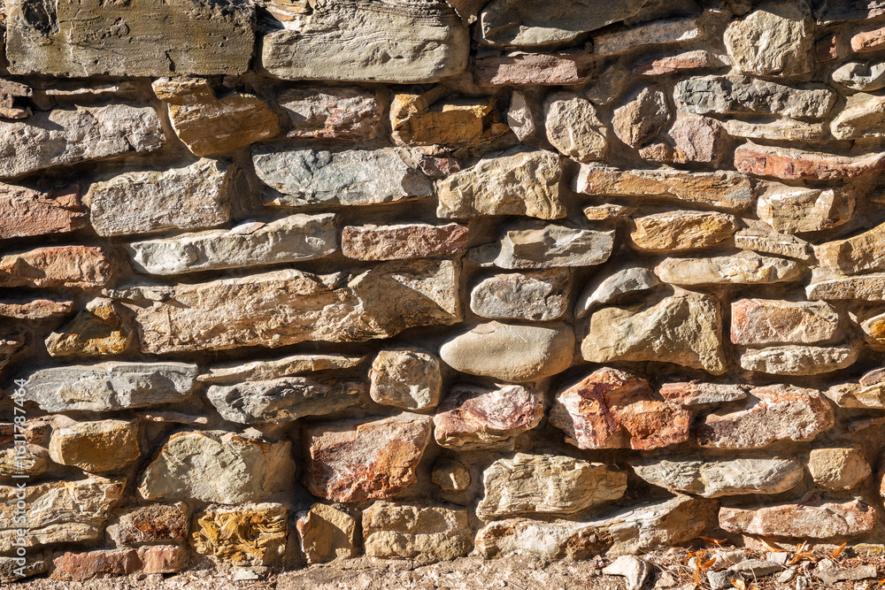 Fototapeta premium Backgrounds of the old stone wall.