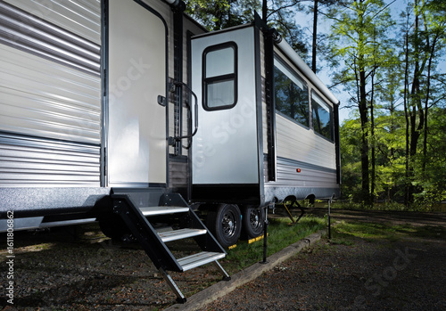 Slide out extended in a camper trailer in a forested campground