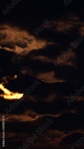 Glowing Orange Full Moon Timelapse in the Night Sky with Clouds Vertical Video