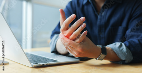 Konstfotografi close up employee man massage on his hand and arm for relief pain from hard work