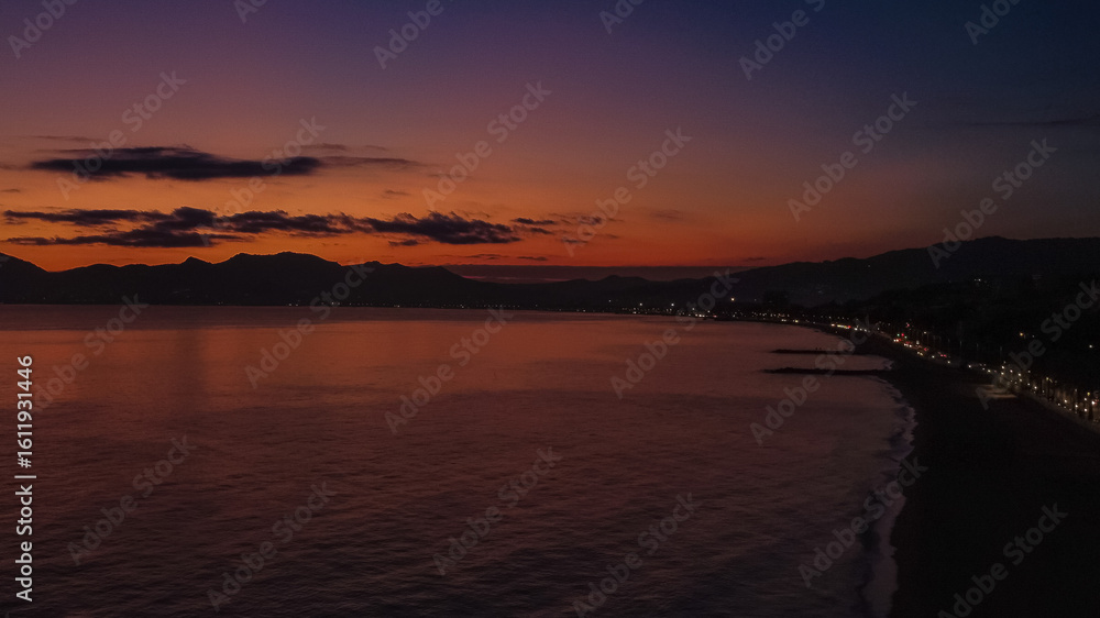 Sunset over Cannes beach, aerial view Sunset over Cannes beach, aerial view