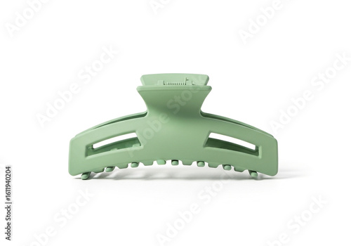 A pastel green matte hair claw clip isolated on white