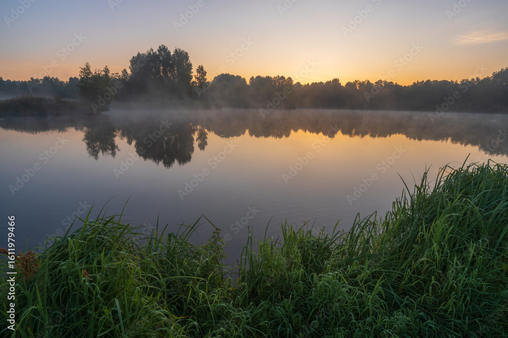 Fototapeta premium misty sunrise over the lake