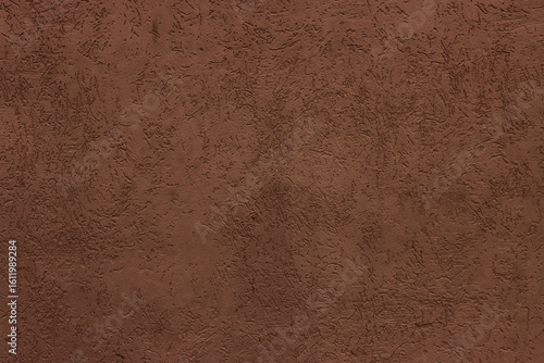 Abstract background of dark brown plaster.
