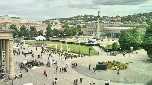 Germany Stuttgart 16.07.2025.Explore the lively vibe of a bustling city square filled with diverse people and lush green spaces