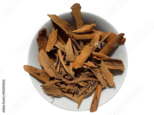 Broken Ceylon Cinnamon Bark Pieces in White Bowl ( Transparent image) - Top View Spice Stock Photo

