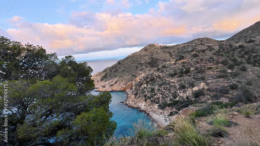 The breathtaking view showcases serene and calm waters encircled by stunningly beautiful hills and vibrant greenery The breathtaking view showcases serene and calm waters encircled by stunningly beautiful hills and vibrant greenery