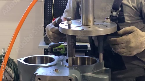 Mechanic placing alignment tool on engine block