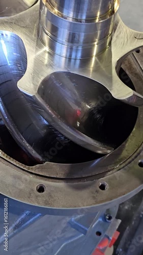 Shiny new screw compressor rotors rotating smoothly
