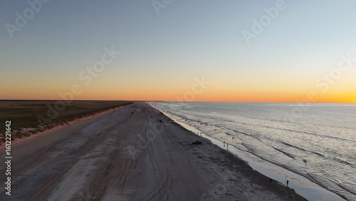 Aerial drone view of sunset at 80 Eighty Mile Beach in Western Australia