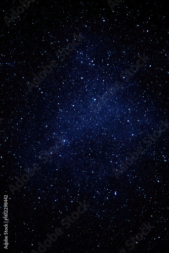 A vast field of stars twinkles in the dark night sky, creating a mesmerizing view of outer space. Cosmic wonder and serenity