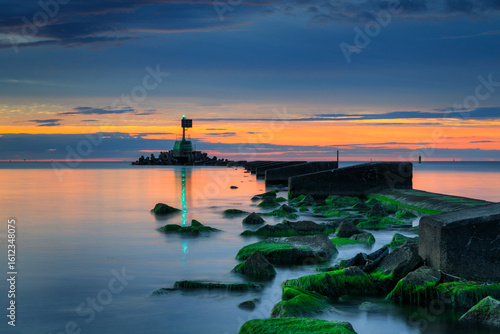 Fototapeta Naklejka Na Ścianę i Meble -  Sunset over the Baltic Sea beach in Gorki Zachodnie, Gdansk. Poland