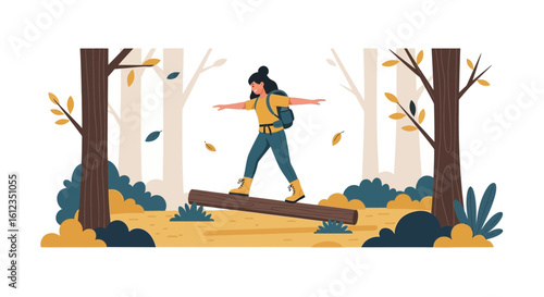 A young woman hiker carefully balances on a log during her outdoor nature adventure trek