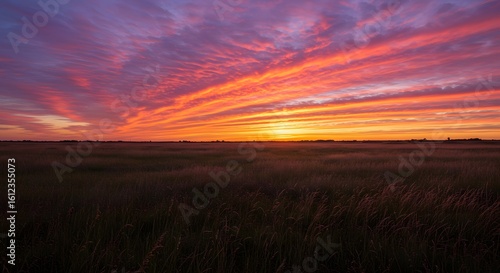 Colorful sunset sky over open field, no horizon interruption
