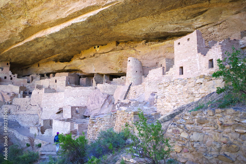 Stone Dwellings of Cliff Palace with Visitor in Mesa Verde National Park