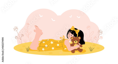 Little Girl Lying On The Grass With Her Teddy Bear Enjoying Nature