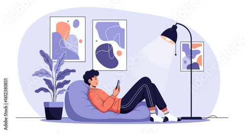 Young Man Relaxes on Beanbag While Using Smartphone At Home And Indoor