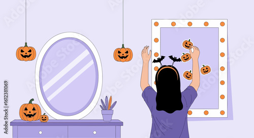 Spooky Season: Woman Decorating Vanity Mirror With Halloween Stickers For Festive Vibe