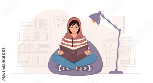 Young woman reading book on beanbag chair in cozy room with bookshelves and lamp