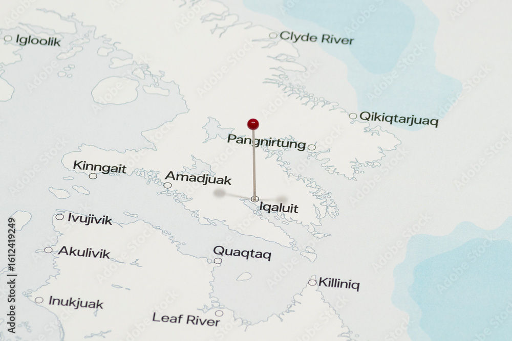 Fototapeta premium red pin needle into Iqaluit city of Canada political map