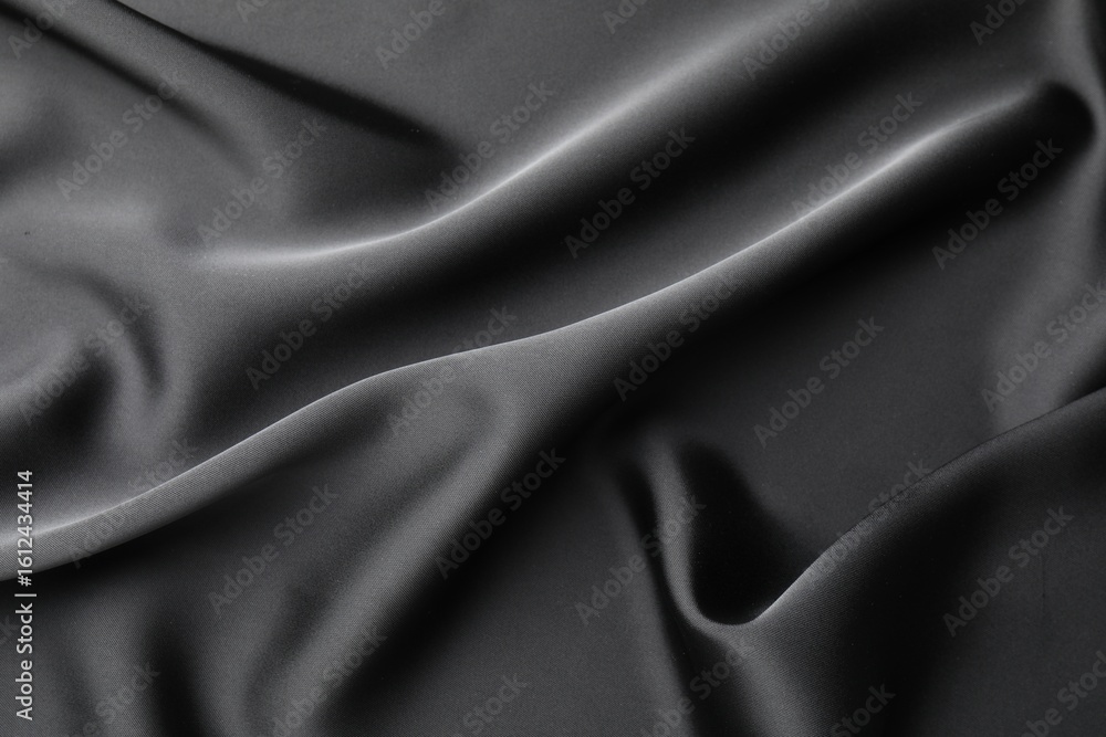 Fototapeta premium Crumpled black silk fabric as background, top view