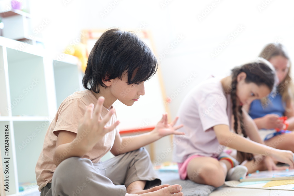 Fototapeta premium portrait of pretty young teenage girl with brown hair holding teddy bear